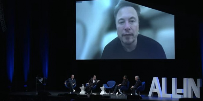 Musk at the All-In Summit, screenshot from the livestream